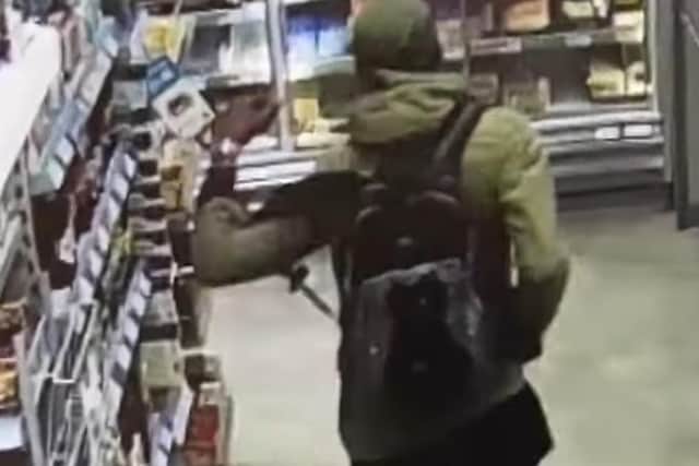 Reece Fraser-Davis, 37, was spotted loading multiple packets of bacon, salmon, coffee and cheese, before dashing out the Co-op store