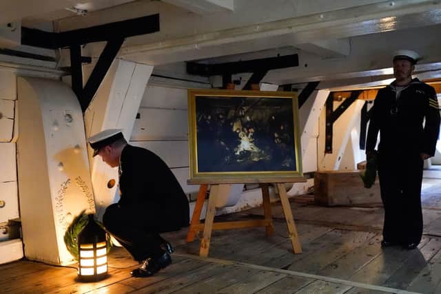Second Sea Lord Vice-Admiral Martin Connell (left) lays a wreath on the Orlop deck at the spot where Vice-Admiral Horatio Nelson died, as Royal Navy personnel and guests take part in a ceremony on board HMS Victory in Portsmouth to mark the 217th anniversary of the Battle of Trafalgar. Picture: Andrew Matthews/PA Wire