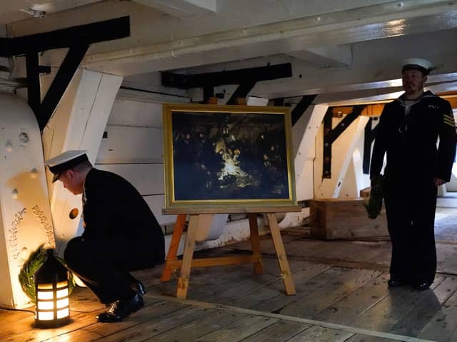 Second Sea Lord Vice-Admiral Martin Connell (left) lays a wreath on the Orlop deck at the spot where Vice-Admiral Horatio Nelson died, as Royal Navy personnel and guests take part in a ceremony on board HMS Victory in Portsmouth to mark the 217th anniversary of the Battle of Trafalgar. Picture: Andrew Matthews/PA Wire