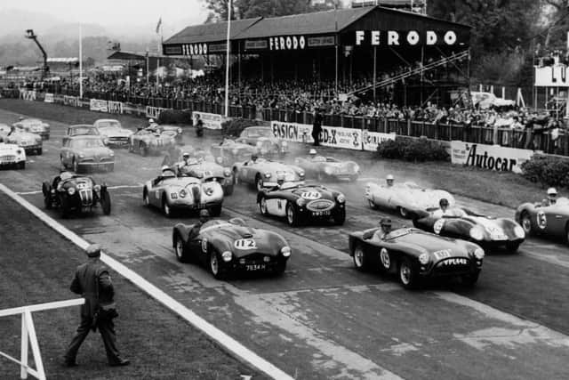Glorious Goodwood at its best, as clubracing sports cars stream away from the starting grid in 1957. The News PP4802