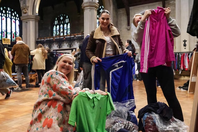 Natalie Evans (left) with her daughter and a family friend at Worth the Weight Vintage Kilo Sale, St Mary's Church, Fratton. Picture: Chris Moorhouse (010225-47)