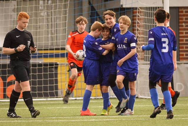 Action from the Portsmouth Youth League Stuart Madigan Cup final between Baffins Milton Rovers Vipers U14s (all blue kit) and AFC Portchester Vikings U14s (orange and black kit). Picture: Keith Woodland (190321-971)