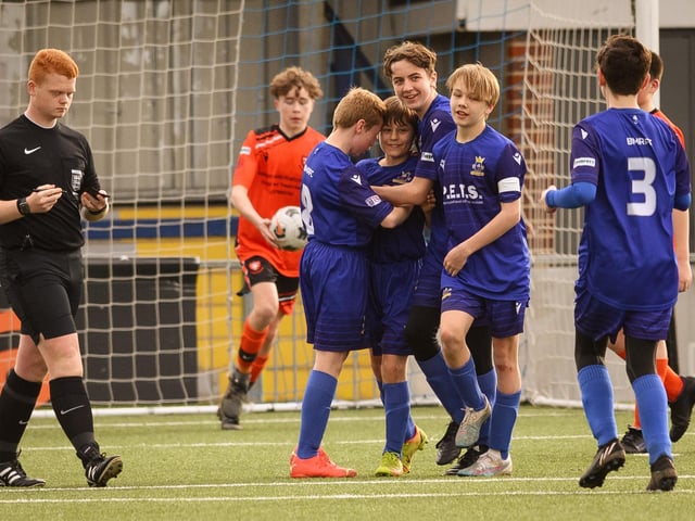 Action from the Portsmouth Youth League Stuart Madigan Cup final between Baffins Milton Rovers Vipers U14s (all blue kit) and AFC Portchester Vikings U14s (orange and black kit). Picture: Keith Woodland (190321-971)