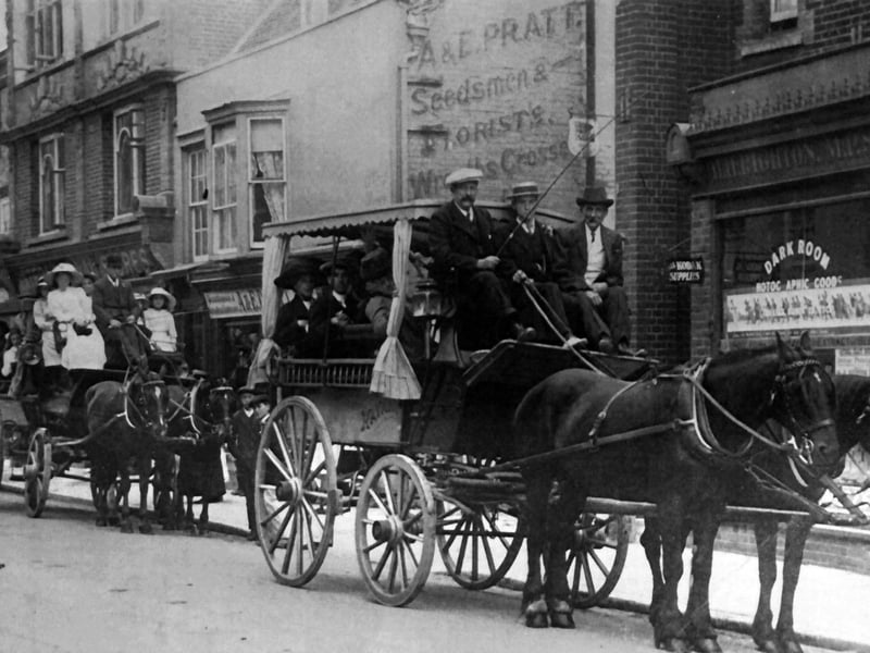 Waggonettes in Havant West Street. A & E Pratt Seedsman and Florist is behind with a Dark Room and Kodak supplies on the sign next door. *The design on the building on the top left can be seen in images 4 as well.* Picture: Ralph Cousins collection.