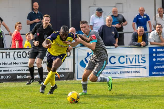 Nick Dembele takes on a Parkway defender during the first half of Gosport's FA Cup first qualifying round success. Picture: Mike Cooter