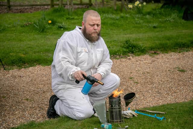 Weekend Cover story on what its like to be a bee keeper

Pictured: Aaron Dancey of Portsmouth Beekeeping Associationbee preparing a bee smoker in West Ashling on 29th March 2022

Picture: Habibur Rahman