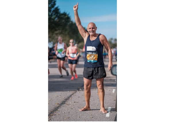 Brave Jason West, 60, ran the entire 10-mile Great South Run course through Portsmouth without any shoes in aid of his chosen charity Médecine Sans Frontiéres, Doctors Without Borders. Photo: Mike Woods