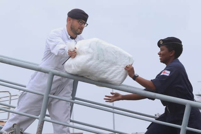 Crew members pictured loading up stores before Trent departed for the Mediterranean on Monday. Photo: Royal Navy