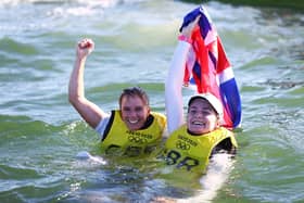 Eilidh McIntyre, right, and Hannah Mills celebrate their gold medal following the Women's 470 class medal race on day 12 of the Tokyo 2020 Olympics at Enoshima Yacht Harbour. Photo by Clive Mason/Getty Images.