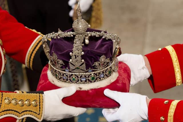 The Imperial State Crown worn by Queen Elizabeth II for the State Opening of Parliament in the House of Lords at the Palace of Westminster in London Picture: Alastair Grant/PA Wire