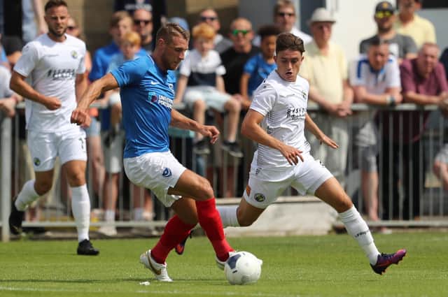 Lee Brown on the ball in Pompey's friendly at the Hawks last summer. Picture by Dave Haines