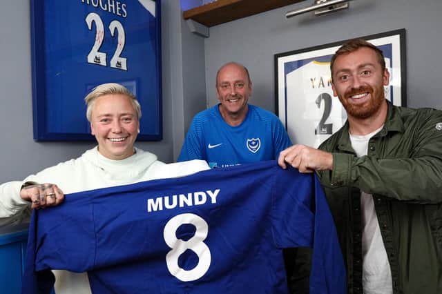 Ian Mundy, centre, and his daughter Becky and son Tom, with a shirt commemorating his father, Albert, which will be going up in 'shirt corner', alongside those of other Pompey greats. The Old House At Home, Locksway Rd, Milton Picture: Chris Moorhouse (jpns 170821-01)