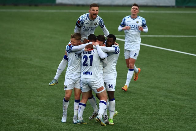 Sam Matthews is mobbed after scoring the late winner. Picture by Dave Haines