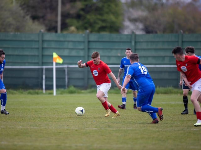 Action from Gosport Town's 4-0 victory over Lee Rangers (blue kit) in the Portsmouth & District FA Trophy final at Cams Alders. Picture: Alex Shute