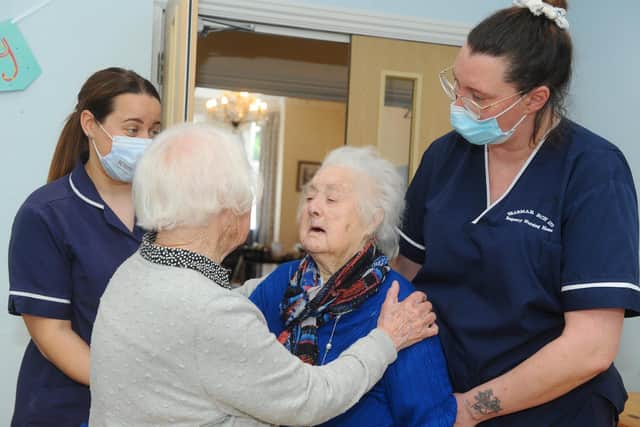 Portsmouth's oldest identical twins celebrated their 93rd birthday on Monday, April 18 at Braemar Care Home in Southsea.Pictured is:  (left and right) Senior carers Joanne Woodacre and Amy Saunders with identical twins (middle l-r) Barbara Walford and Beryl Taylor.Picture: Sarah Standing (220422-2205)