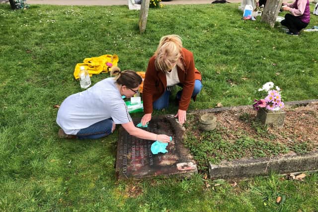 More than a dozen residents turned out to help clean up the spray paint. Picture: Richard Lemmer