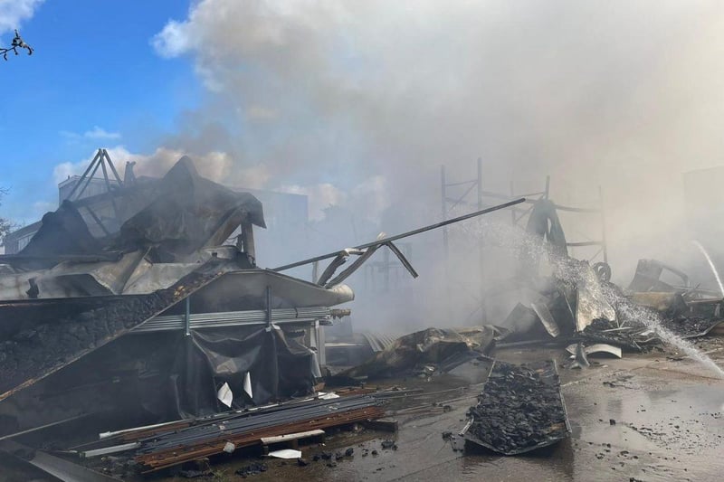More than 80 firefighters were deployed to tackle a ferocious garage fire, which spread to nearby vehicles and buildings. Smoke could be seen filling the sky.