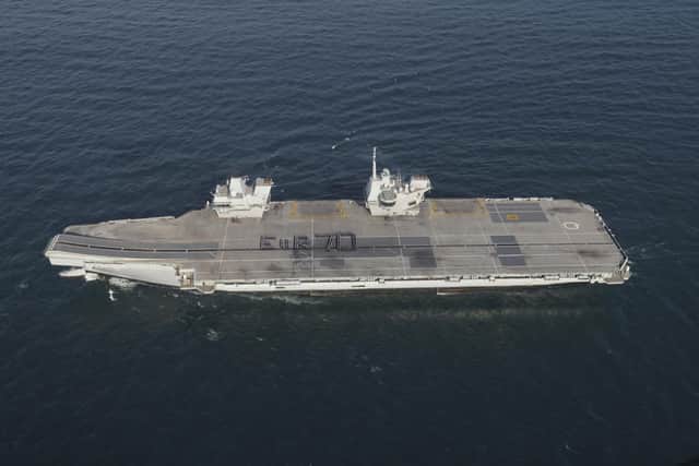 More than 300 Royal Navy sailors spelling out a giant Platinum Jubilee greeting to the Queen on the flight deck of the aircraft carrier HMS Queen Elizabeth. Nearly half the crew of the Navy's flagship stood strong in bracing winds to form the tribute spelling out E II R 70 while off the south coast of England. Issue date: Tuesday May 31, 2022.