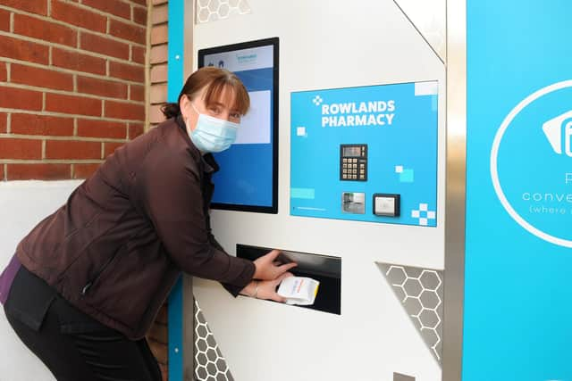 Rowlands Pharmacy in Stoke Road, Gosport, are trialling the first prescription vending machine. PharmaSelf 24 gives patients a 24/7 collection point, notifying them by SMS text message on the status of their prescription, allowing them to avoid any wasted trips.

Pictured is: Terri Morgan, non pharmacist manager at Rowlands Pharmacy in Stoke Road, Gosport, using the prescriptions vending machine.

Picture: Sarah Standing (131020-5578)