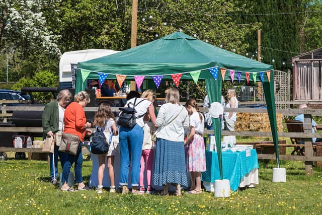 Visitors at one of the stalls at Catherington Craft Fair. Picture: Mike Cooter (310521)