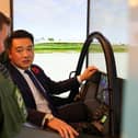 Alan Mak MP talks to an F-35 pilot after experiencing the cockpit demonstrator