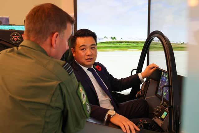 Alan Mak MP talks to an F-35 pilot after experiencing the cockpit demonstrator