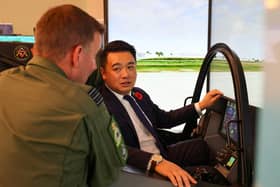 Alan Mak MP talks to an F-35 pilot after experiencing the cockpit demonstrator