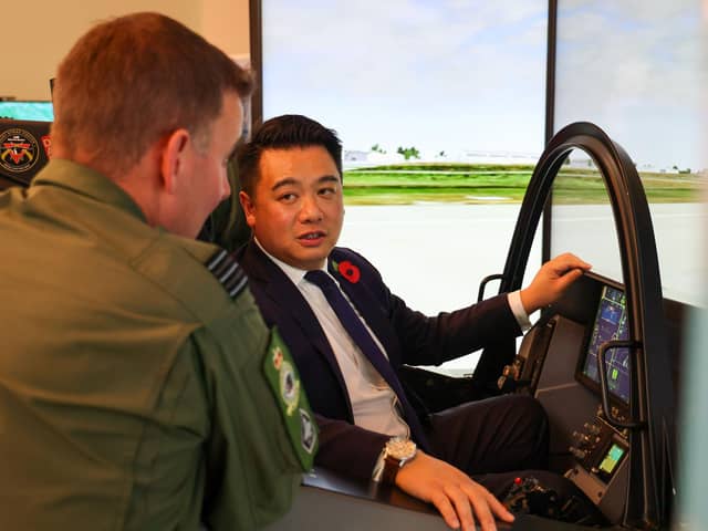 Alan Mak MP talks to an F-35 pilot after experiencing the cockpit demonstrator