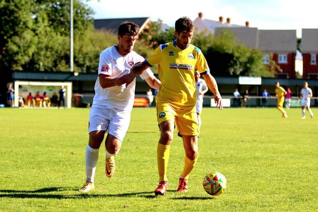 Danny Hollands, right, in action against Truro. Picture by Tom Phillips