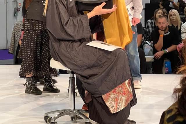 Alex showcasing her skills with her ‘Hair Up’ model