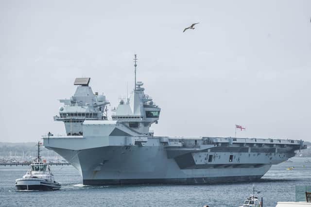 HMS Queen Elizabeth departs from Portsmouth after ship's crew is tested for Covid-19 on Wednesday 29 April 2020.Pictured: HMS Queen Elizabeth passes the Round Tower, Old Portsmouth  .Picture: Habibur Rahman