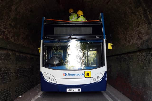 The scene on Well House Lane in Winchester after three children were taken to hospital with serious injuries while 12 others suffered minor injuries after the school bus they were travelling in crashed into a railway bridge. Picture: Andrew Matthews/PA Wire