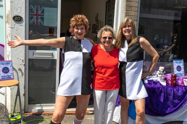 The staff from Ladies First Fitness show how the sixties swung. Pictured: Fran Noble, Denise Henley, 75, and Sharen White, 61 Picture: Mike Cooter (040622)