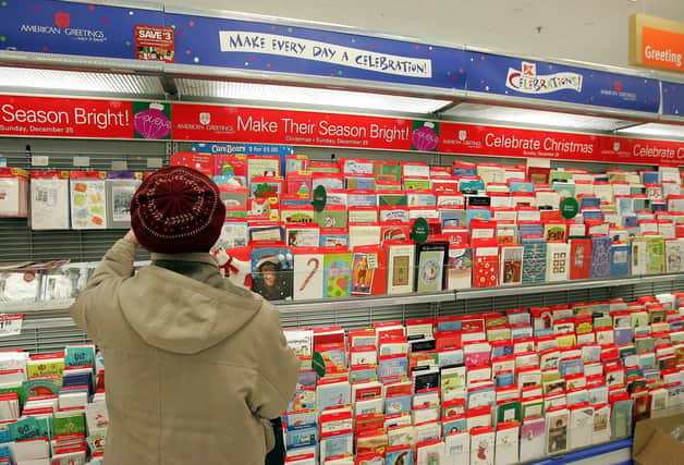 Shopping for Christmas cards.  Photo by Tim Boyle/Getty Images