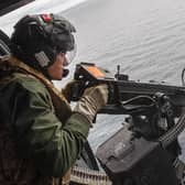 Pictured: 814 Naval Air Squadron take part in a small arms firing at sea whilst on maritime security patrols in around around UK waters with HMS Kent.