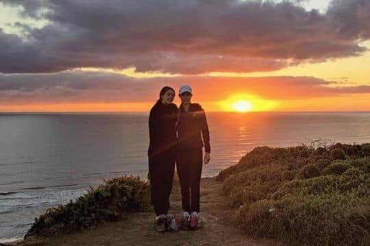 Left to right: Daisy and Holly at sunset. They had asked someone to take a photo on their phone and email it to their mum as they do not have a smartphone.