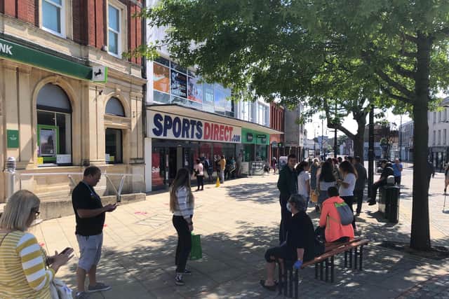 The reopening of non-essential shops saw some queues in the high street, including customers queuing to shop in Sports Direct. Picture: Richard Lemmer.