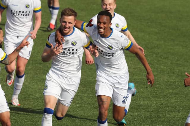 Jake McCarthy, right, is quickly joined by two-goal Manny Duku after his stunning opener in the win over eight-man Eastbourne Borough Picture: Dave Haines