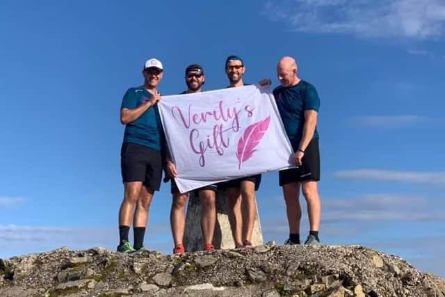 Supporters of Emsworth charity Verity's Gift completed the Three Peaks Challenge by running up each mountain and cycling between them. Pictured: Nick Slade, Philip Robertson, Mike Magill and George Turner on top of Ben Nevis