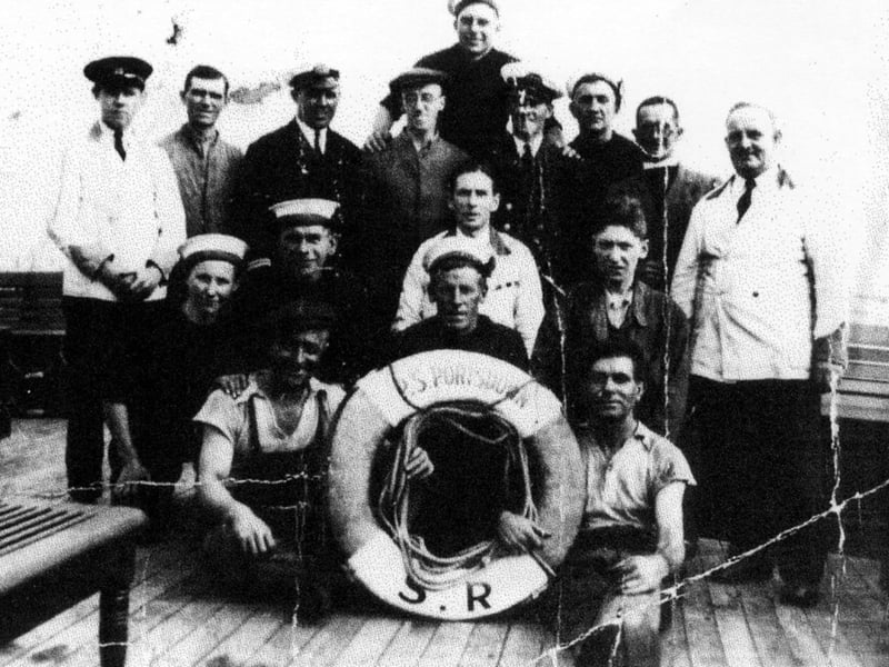 The crew of the paddle steamer Portsdown with Arthur Bundy standing fourth from the right in the white cap.