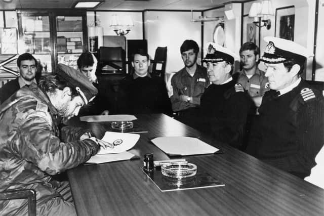 Teniente de Naviro (Lieutenant) Alfredo Astiz signing the Instrument of Surrender on behalf of all Argentine forces at Lieth, on South Georgia on board HMS Plymouth. He was held at Chichester as a prisoner-of-war