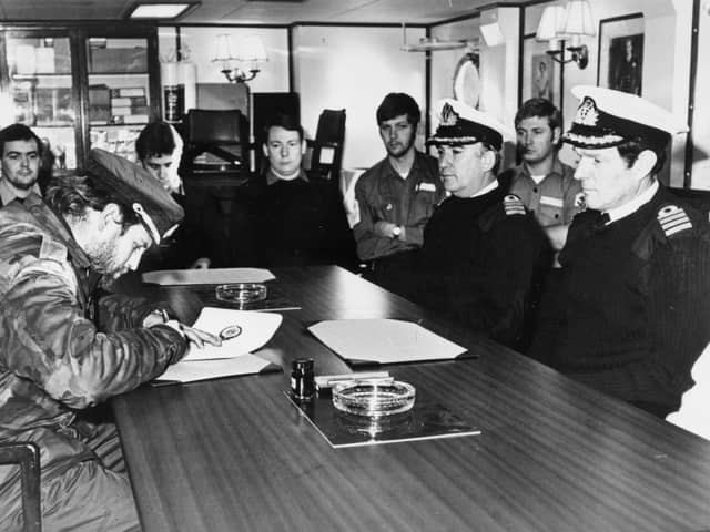 Teniente de Naviro (Lieutenant) Alfredo Astiz signing the Instrument of Surrender on behalf of all Argentine forces at Lieth, on South Georgia on board HMS Plymouth. He was held at Chichester as a prisoner-of-war