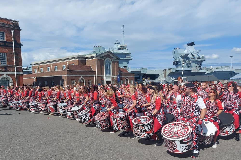 Batala Portsmouth hosted an international encontro of 280 drummers from 14 different countries from August 22-27 2023, seen here at The Historic Dockyards.
