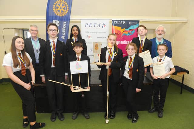 Children from Trafalgar School with some of their billboard circuit designs. (Back left) John Lovell, Rotary assistant governor with (back right) Lawrence Tristram, district governor for the Rotary Club with (left to right) Madison Stubbington-Bartlett, 13, Maksymilian Stadnik, 13, Mysha Ali, 13, Declan Wilson, 12, Tegan Hollingsworth, 13, Maisie Heggie, 12, Kian Murphy, 13 and Ethan Pook, 12.
Picture: Sarah Standing
