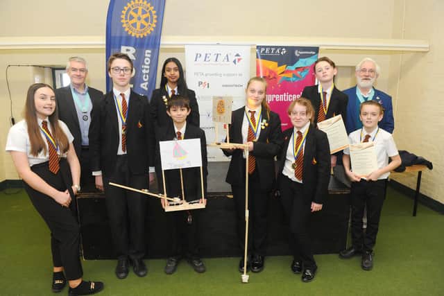 Children from Trafalgar School with some of their billboard circuit designs. (Back left) John Lovell, Rotary assistant governor with (back right) Lawrence Tristram, district governor for the Rotary Club with (left to right) Madison Stubbington-Bartlett, 13, Maksymilian Stadnik, 13, Mysha Ali, 13, Declan Wilson, 12, Tegan Hollingsworth, 13, Maisie Heggie, 12, Kian Murphy, 13 and Ethan Pook, 12.

Picture: Sarah Standing