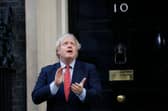 Britain's Prime Minister Boris Johnson participates in a national clap for carers to show thanks for the work of Britain's NHS (National Health Service) workers and other frontline medical staff around the country as they battle with the novel coronavirus pandemic, outside 10 Downing Street (Photo by Tolga AKMEN / AFP) (Photo by TOLGA AKMEN/AFP via Getty Images)