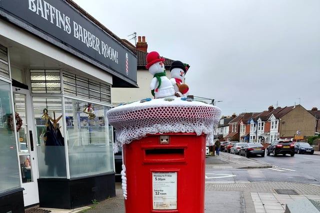 A festive woollen post box topper on Tangier Road.