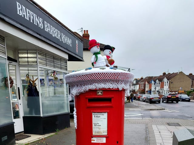 A festive woollen post box topper on Tangier Road.