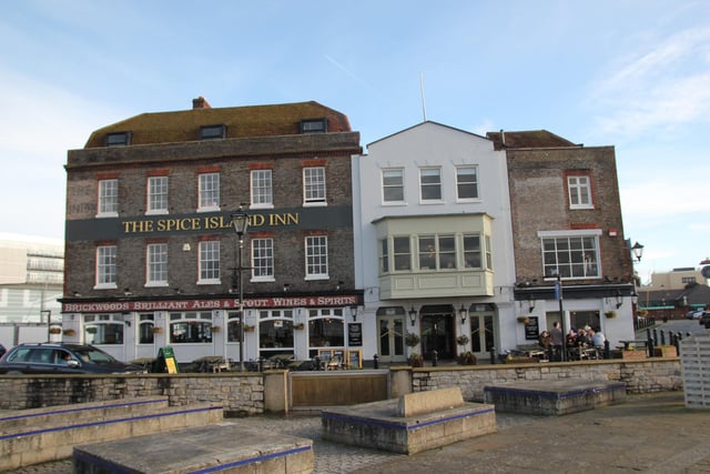 A view of the faded signs at the Spice Island pub, visible top-left and top-right.