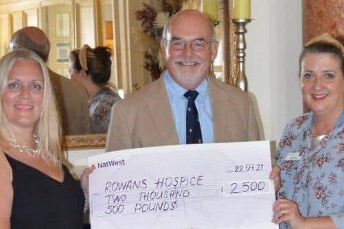 Queens Hotel general manager Catherine Austen, left, with Rowans Hospice's chair of trustees John Watkins and CEO Ruth White